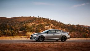 A silver 2022 Nissan Maxima shot in profile