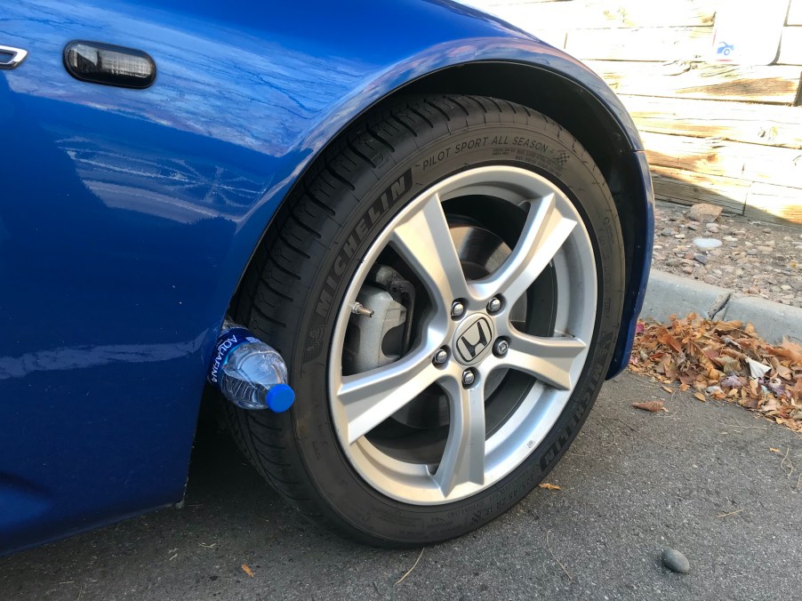 Water bottle wedged in S2000 wheel well