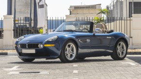 A dark-blue 2000 BMW Z8 parked in a city