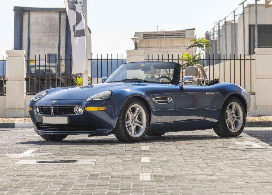 A dark-blue 2000 BMW Z8 parked in a city