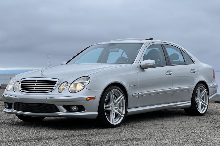 A silver 2003 Mercedes-Benz E55 AMG on a wharf