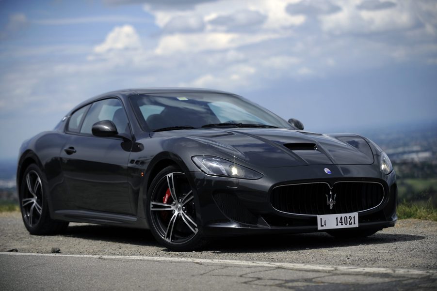 A black 2012 Maserati GranTurismo MC Stradale on a mountain road