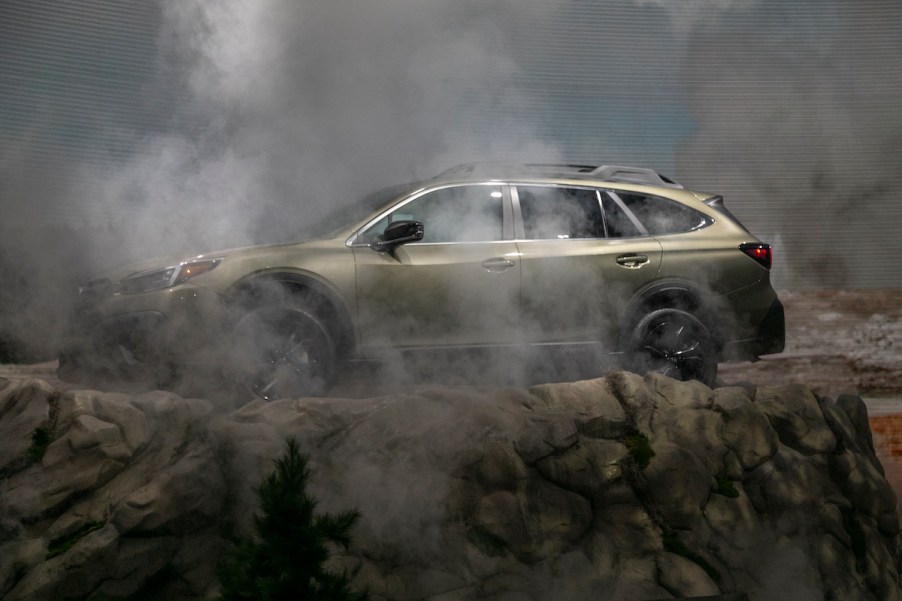 A green 2020 Subaru Outback in a U.S. National Park-themed display