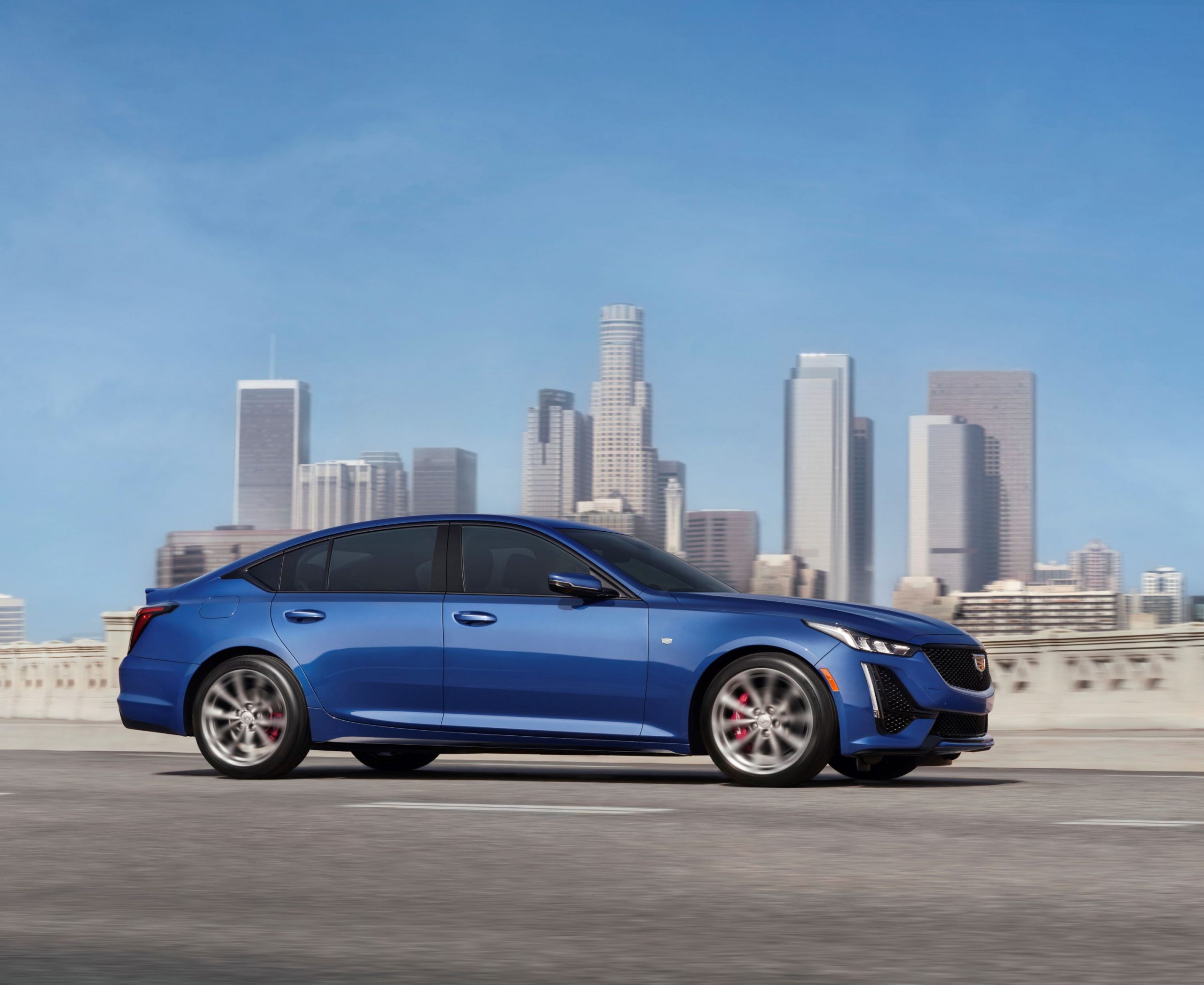 A blue 2021 Cadillac CT5 sedan in profile