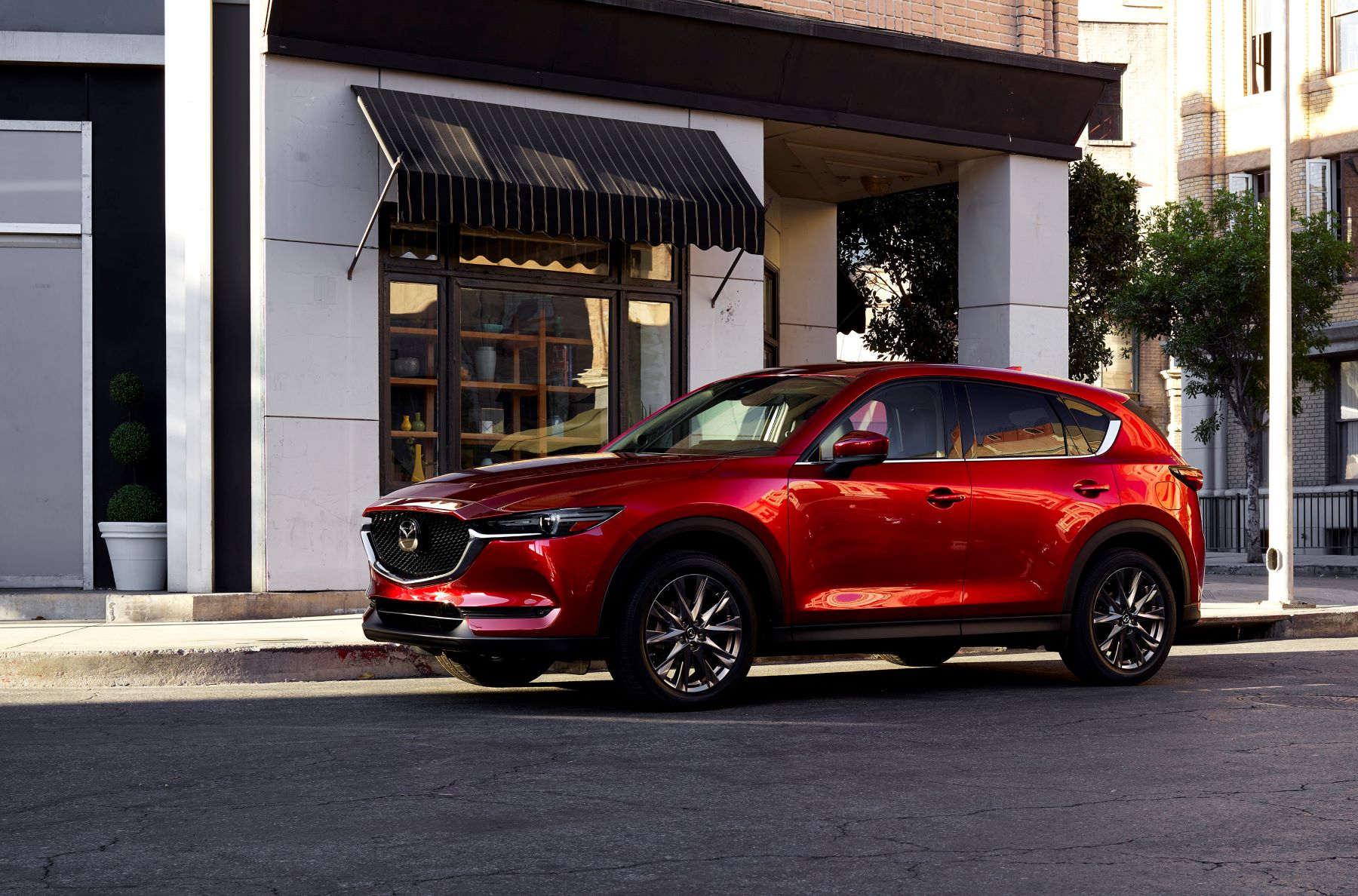 A 2021 Mazda CX-5 compact SUV with the Soul Red Crystal Metallic paint color option