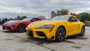 A red 2021 Toyota GR Supra 3.0 Premium next to a yellow 2021 Toyota GR Supra 2.0