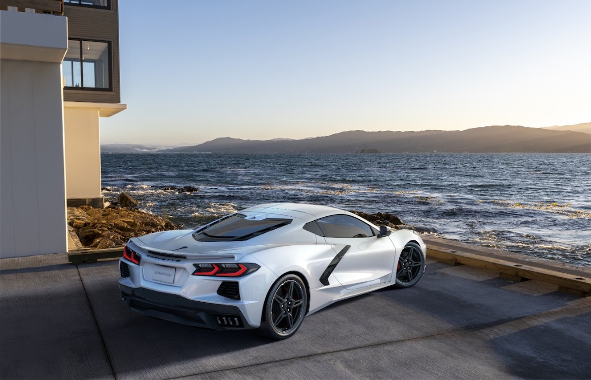 A white 2022 Chevrolet Corvette Stingray with optional spoiler for non-Z51-equipped models