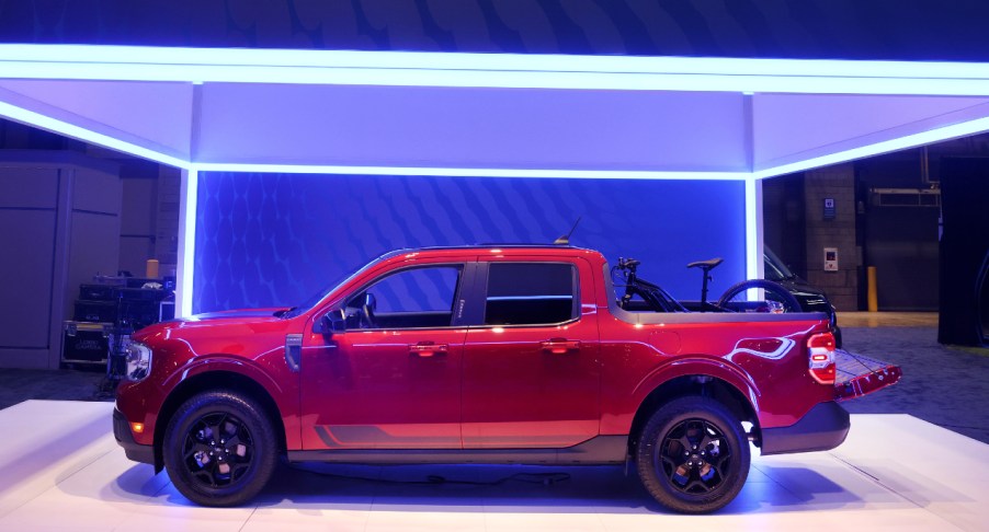 A red 2022 Ford Maverick pickup truck is on display.