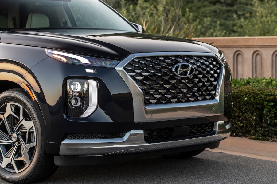 Black 2022 Hyundai Palisade parked on the side of a road