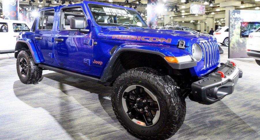 A blue Jeep Gladiator is on display.