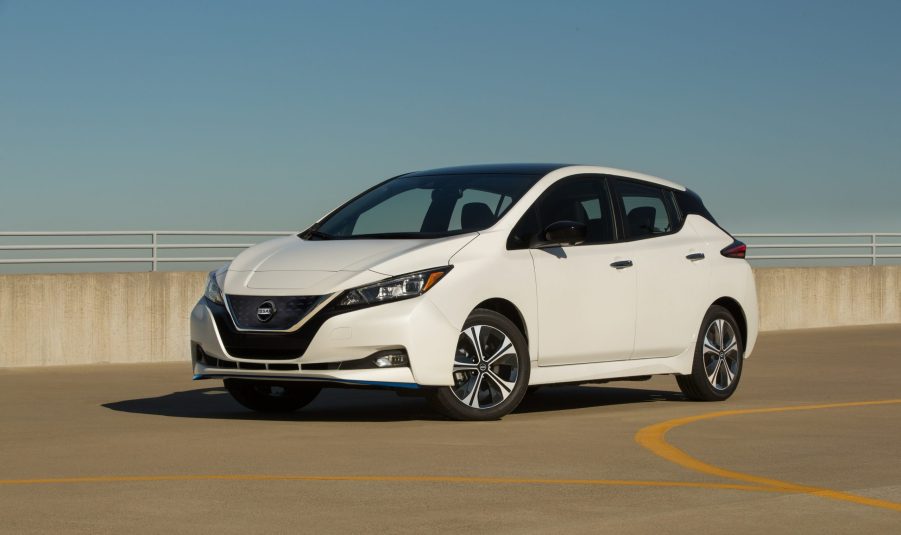 A white Nissan Leaf EV hatchback shot from the front 3/4