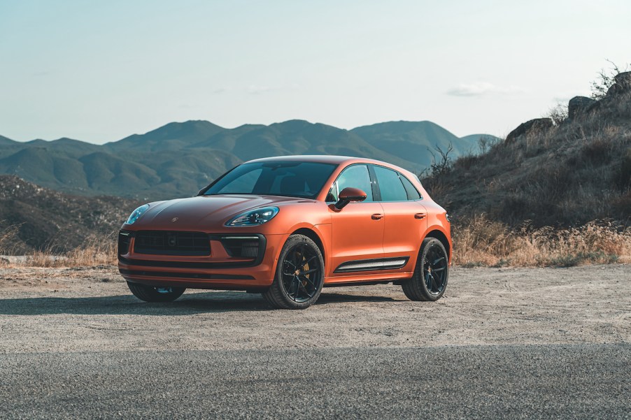 A 2022 Porsche Macan S luxury compact crossover SUV in Papaya Orange