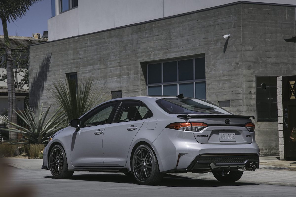 A silver 2022 Toyota Corolla Apex Exterior parked outside a modern gray building