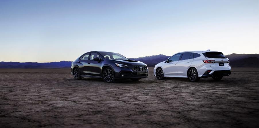 A pair of white and black 2022 Subaru WRX Sportwagon models made for the JDM