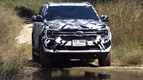 2023 Ford Everest, an SUV version of the Ranger, driving through water