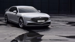 A white 2023 Genesis G90 full-size sedan