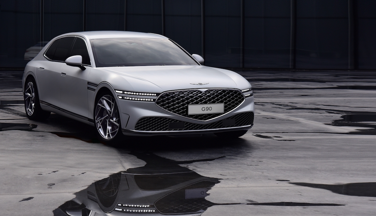 A white 2023 Genesis G90 full-size sedan