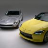 A yellow 2023 Nissan Z shot next to a silver Datsun 240Z