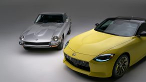 A yellow 2023 Nissan Z shot next to a silver Datsun 240Z