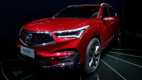 A red Acura RDX luxury SUV model.