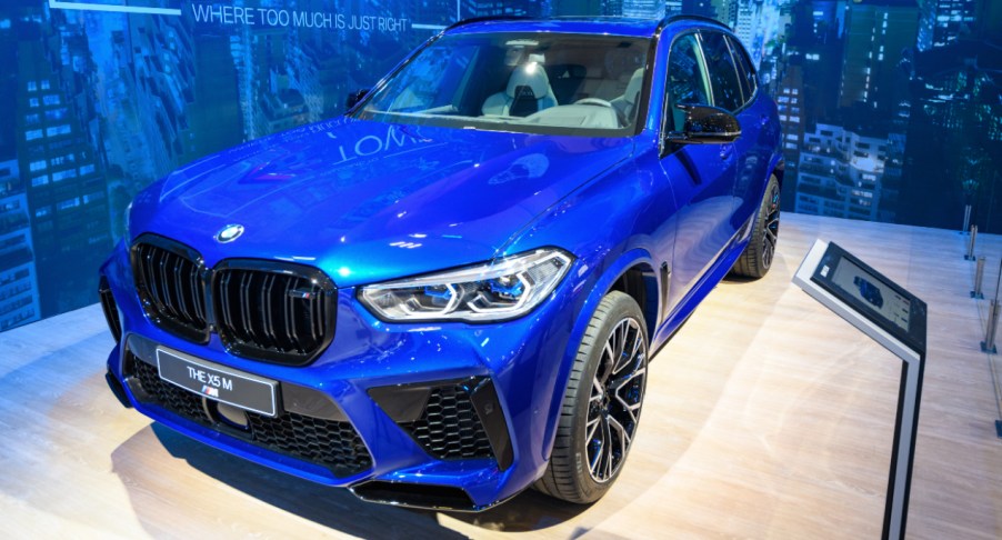 A blue BMW X5 midsize luxury SUV model.