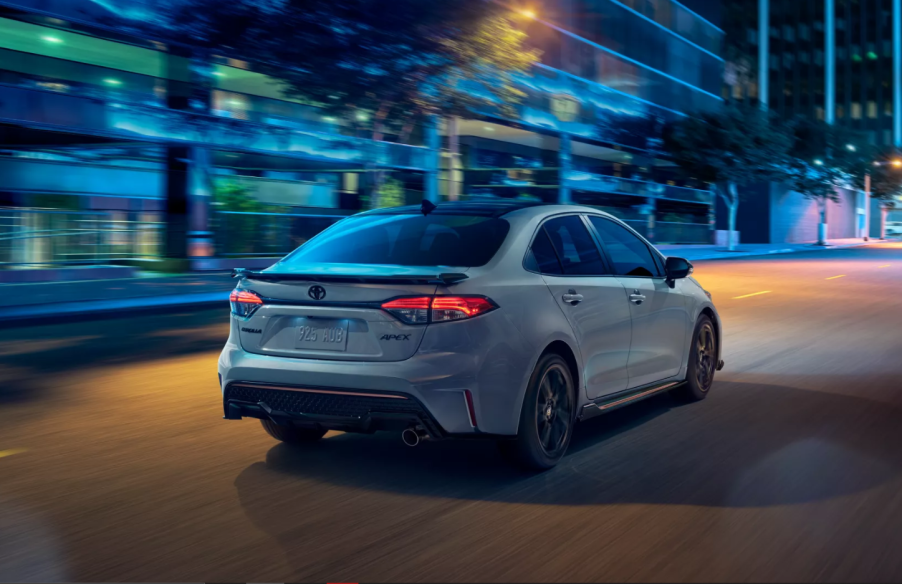 Celestite Gray Metallic 2022 Toyota Corolla driving on a street at night