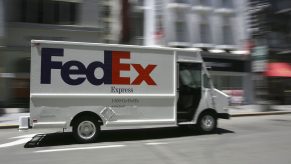 A white FedEx delivery van, which will soon be replaced with BrightDrop EV600 models, the next electric delivery van.