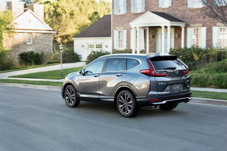 Gray 2022 Honda CR-V driving by houses