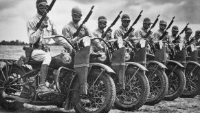 The Harley- Davidson Motor Co. built more than 90,000 motorcycles during World War II for the armed forces. A row of Army Armored Division contingency of mounted soldiers made and impressive sight | Getty Images