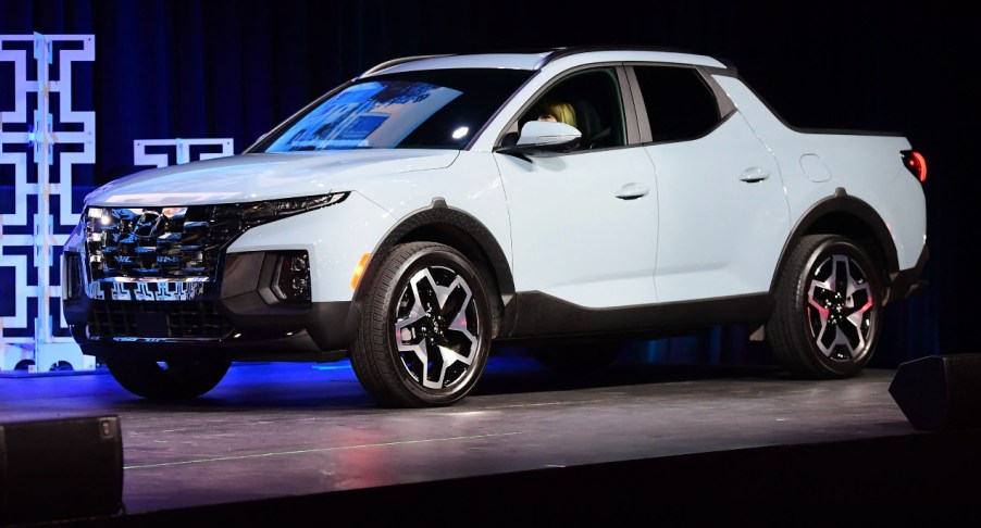 A white 2022 Hyundai Santa Cruz is on display.