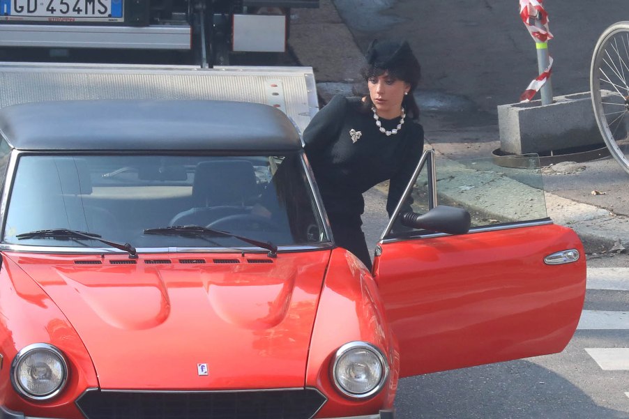 Lady Gaga getting into a Fiat Spider 124 during House of Gucci | Robino Salvatore/GC Images