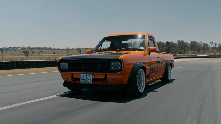 Mad Dog Racing's orange-and-black Honda CBR1000RR-swapped Nissan 1400 on a racetrack