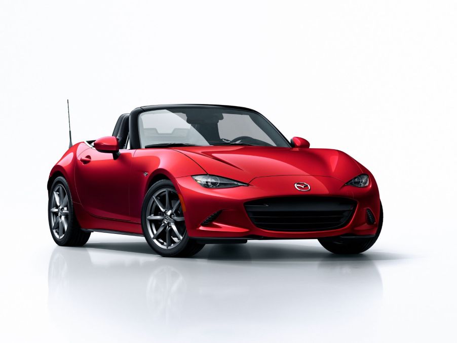 A red Mazda MX-5 on a white background.