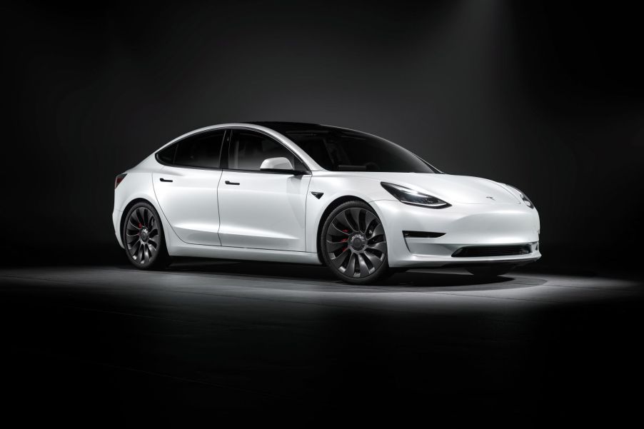 Passenger's side front angle view of white 2021 Tesla Model 3