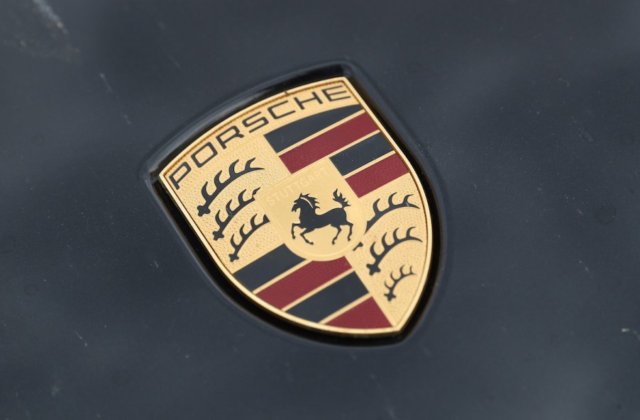 The Porsche logo on the hood of a Cayenne SUV parked on June 13, 2017, in Berlin, Germany