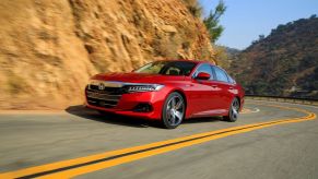 San Marino Red 2022 Honda Accord driving on a curvy road