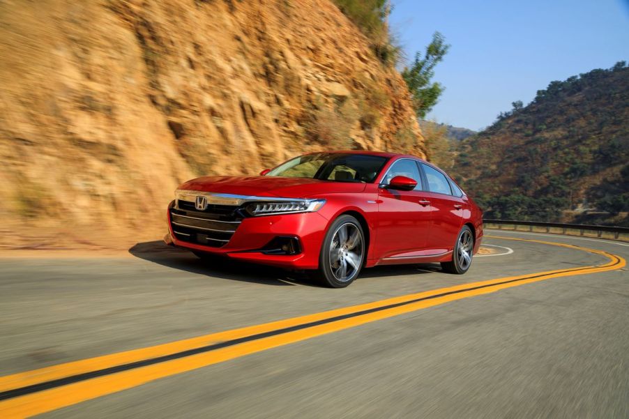 San Marino Red 2022 Honda Accord driving on a curvy road