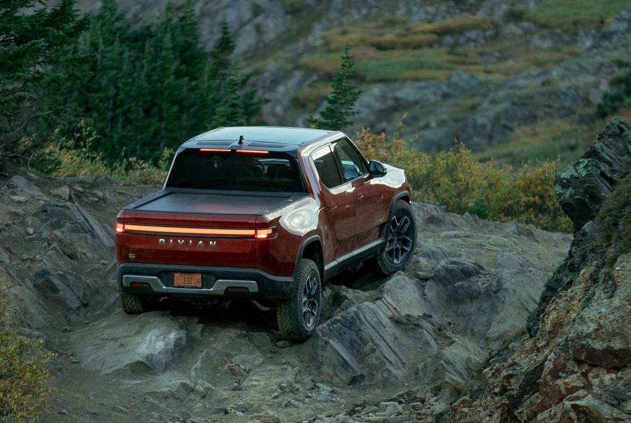 Red Canyon 2022 Rivian R1T driving off-road on a rocky hill