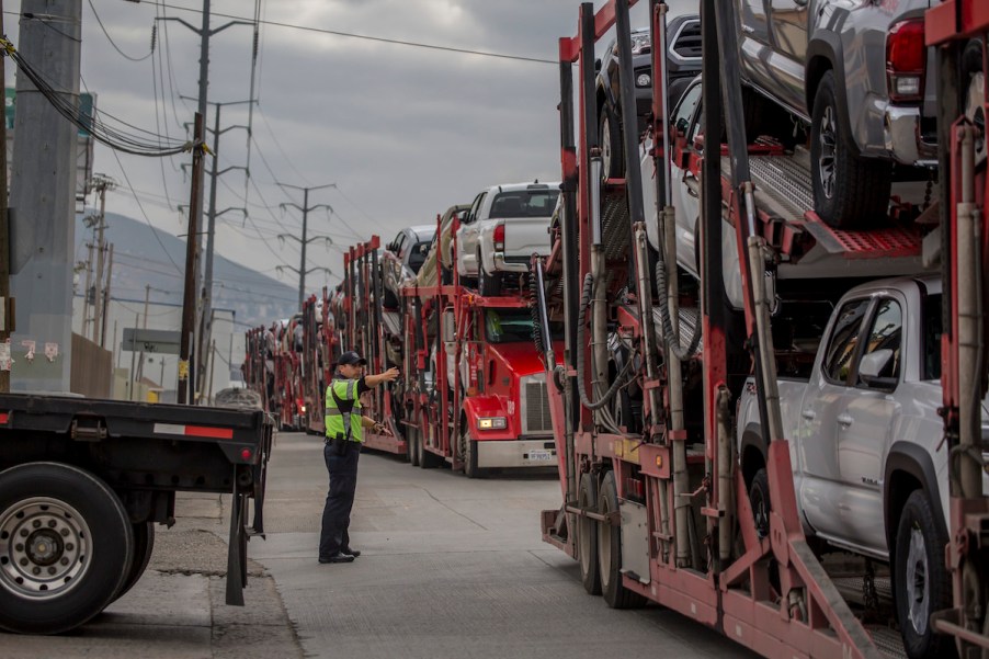 Trucks carrying cars queue in front of the Otay Mesa border crossing in Tijuana in 2019