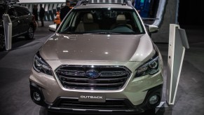 A gray Subaru Outback is on display.