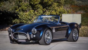 The dark-blue Superformance MKIII-E electric Shelby Cobra replica