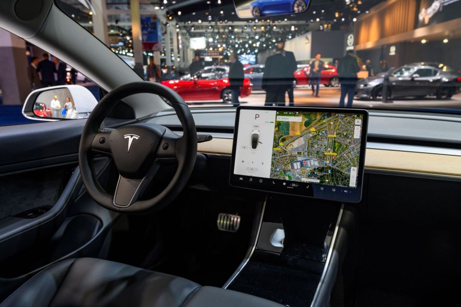 The interior of a Tesla Model 3 with giant screen