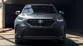 A silver 2022 Toyota Highlander against a black background.