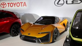 The orange Toyota Sports EV electric sports car concept next to some other EV concepts