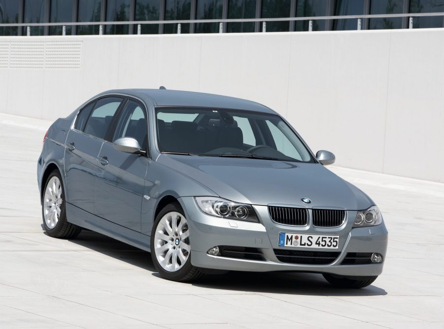 A silver used 2008 BMW E90 328i sedan on a garage rooftop