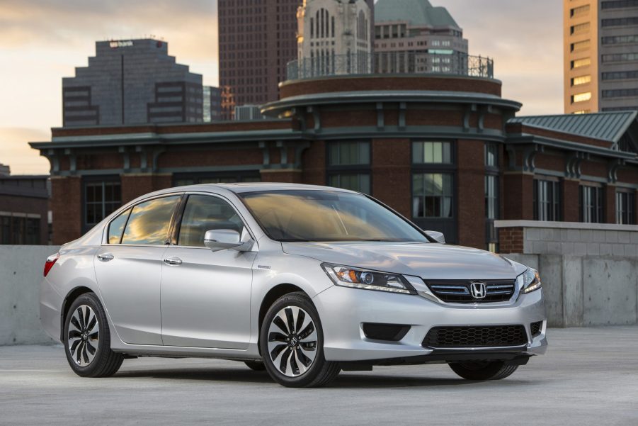 A silver used 2014 Honda Accord Hybrid EX-L sedan on a rooftop garage