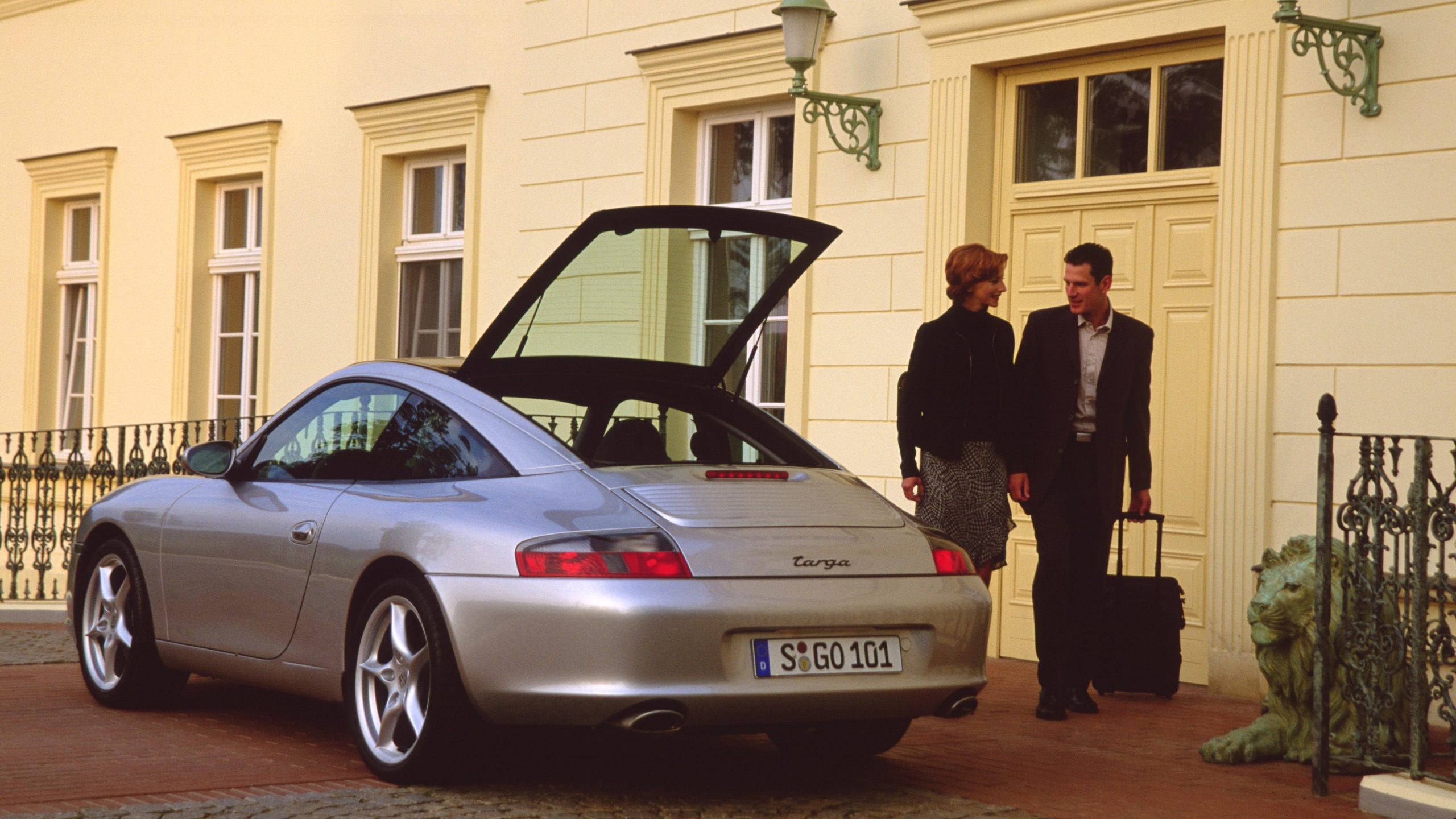 A silver 996 Porsche 911 Targa shot from the rear 3/4