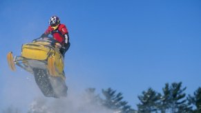 A snowmobile rider in action during the World Championship Snowmobile Derby in Eagle River, Wisconsin