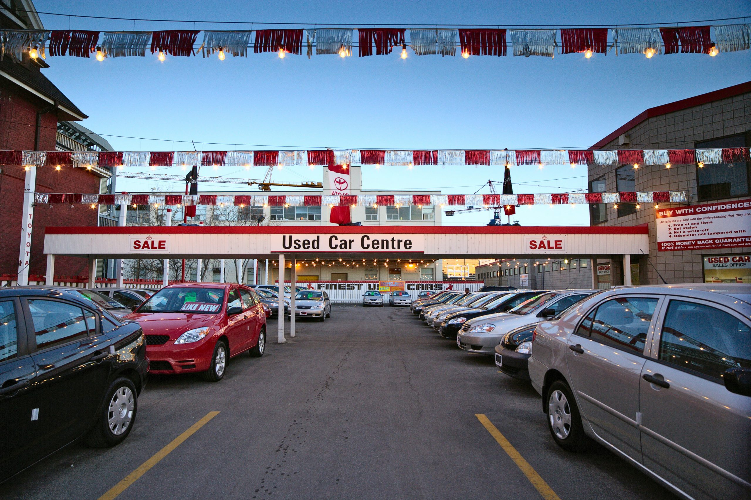 A Toyota dealer lot, full of used cars in a photo taken before the rise in used car prices