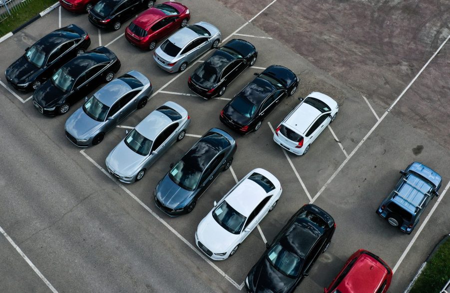 An aerial shot of a used car lot, shown full despite the rise in used and new car prices